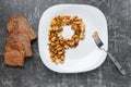 Potatoes and bread, and a fork lie on the table Royalty Free Stock Photo