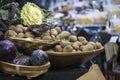 Potatoes and cabbage in baskets on the Borough market in London Royalty Free Stock Photo