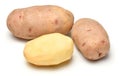 Potatoes close-up, raw and peeled, objects are isolated on a white background Royalty Free Stock Photo