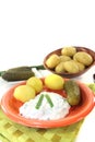 Potatoes with curd, pickles and chives