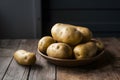 Potatoes displayed on indoor kitchen table, fresh and versatile