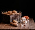 Potatoes garlic carrot vegetable still life raw food wicker basket rustic wooden floor