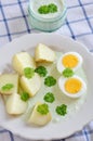 Potatoes with green sauce and eggs