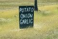 Potatoes, Onions and Garlic For Sale Sign For Rural Stall