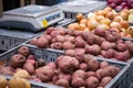 Potatoes, onions and radishes at a farmers market