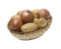 Potatoes and onions on the wicker basket