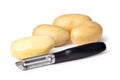 Potatoes and Peeler Royalty Free Stock Photo