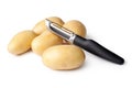 Potatoes and Peeler Royalty Free Stock Photo
