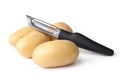 Potatoes and Peeler Royalty Free Stock Photo