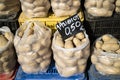Potatoes in plastic bags on a Greek market stall Royalty Free Stock Photo