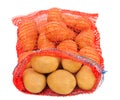 Potatoes in red bag Royalty Free Stock Photo