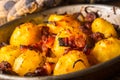 Potatoes. Roasted potatoes with bacon onion and sausages on old