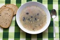 Potatoes soup with mushrooms in white plate