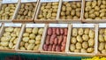 Potatoes species in wooden boxes