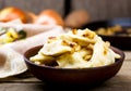 Potatoes vareniki in a ceramic bowl.