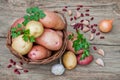 Potatoes in a wicker basket on a wooden table in rustic style Royalty Free Stock Photo