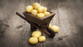 Potatos in a miniature wheelbarrow Royalty Free Stock Photo