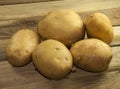 Potatos on wood place Royalty Free Stock Photo