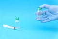 Potential trials stage concept on blue background. Close up Vials with sterile needle syringe. Research and Development, Royalty Free Stock Photo