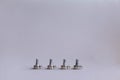 Potentiometers stand on the gray background. Many Potentiometers. Macro close up of electronic component potentiometer Royalty Free Stock Photo