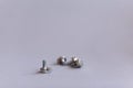 Potentiometers stand on the gray background. Many Potentiometers. Macro close up of electronic component potentiometer