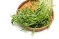 Potherb mustard on a bamboo colander isolated on a white background