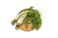 Potherb mustard on a bamboo colander isolated on a white background