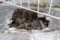 Pothole on Broken Concrete Sidewalk Royalty Free Stock Photo