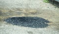 Pothole repaired with Gravel and Tar