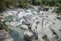 The Potholes of the Giants in the Toce River with green water and waterfall in Uriezzo