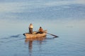 Poti, Georgia - 01.09.2019: A litte boat and the fishermen on the lake in Paliastomi. Poti