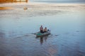 Poti, Georgia - 01.09.2019: A litte boat and the fishermen on the lake in Paliastomi. Poti