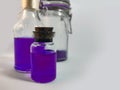 Potions with violet liquid. Alchemy set with flasks. small glass bottles with colored liquid for game role play. magic potions