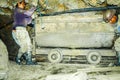 POTOSI, BOLIVIA - JULY 5, 2008: Male miners with carriage in the Cerro Rico mine in Potosi, Bolivia. One of the hardest Royalty Free Stock Photo