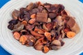 Potpourri Close-up view in the wooden plate with blue background