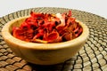 Potpourri of dry flowers in a wooden bowl. For aromatherapy and welness concept