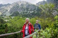 Potrait of active senior woman hiking with husband in autumn mountains. Royalty Free Stock Photo