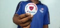 Potrait of Domino`s Pizza Employee showing `I AM VACCINATED` badge