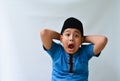 potrait of handsome asian muslim boy with shock expression