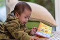 Cute Asian Baby boy with camouflage jacket Royalty Free Stock Photo