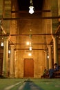 the potrait of mosque interior with chandelier light at night