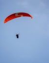 potrait of a paragliding over the blue sky