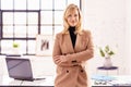 Executive businesswoman portrait while standing at office desk Royalty Free Stock Photo