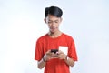 Portrait of a young student asian man talking on mobile phone, speak happy smile Royalty Free Stock Photo