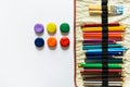 Pots of colorful paint and pencils Royalty Free Stock Photo