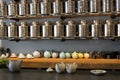 Rows of tin tea containers with tea pots steeping the flavorful blends below, Saratoga Tea & Honey, Saratoga, New York, 2019