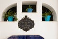 Pots with flowers in the fountain of NÃÂ­jar, Almeria, Spain