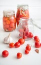 Pots of marinated tomatoes