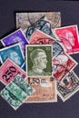 Potsdam, Germany - APR 26, 2022. A stack of old German stamps from the Third Reich and on it a stamp with printed portrait of Royalty Free Stock Photo