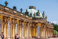 Potsdam, Germany - June 7, 2019: Young tourists in front of the facade of the main nave of the Potsdam palace